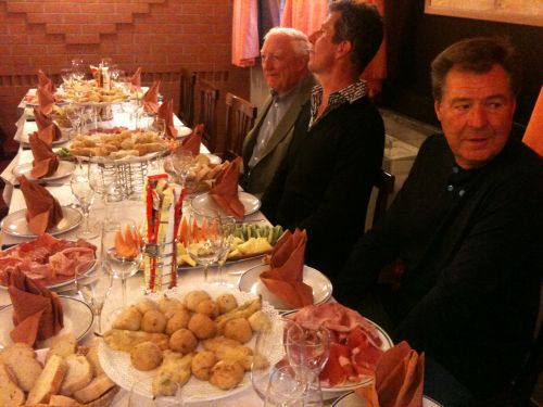 Three wise men await guests to arrive (red)