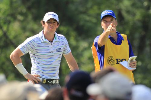 J P Fitzgerald points the line for McIlroy on day two of 2011 US PGA (red)
