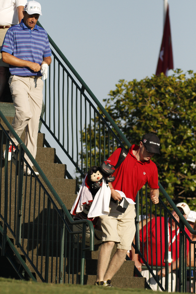 Padraig Harrington rushing down the stairs to the 10th tee.