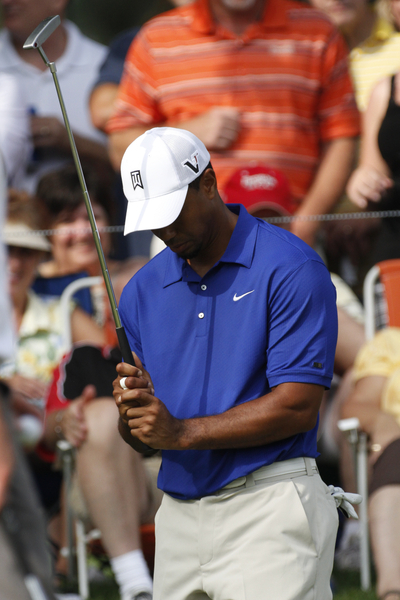 Tiger Woods reacts after missing a birdie putt