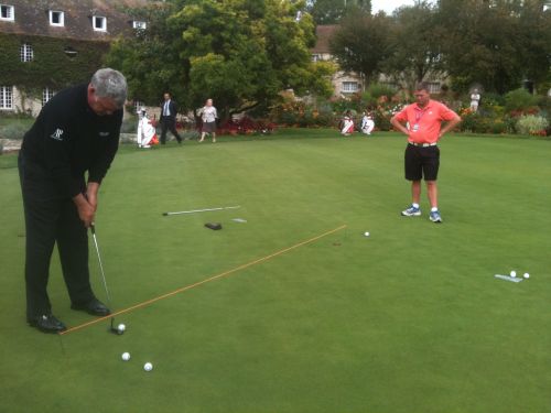 Darren Clarke putting along line of string (red)