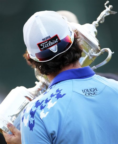 Rory McIlroy back shot kissing US Open trophy