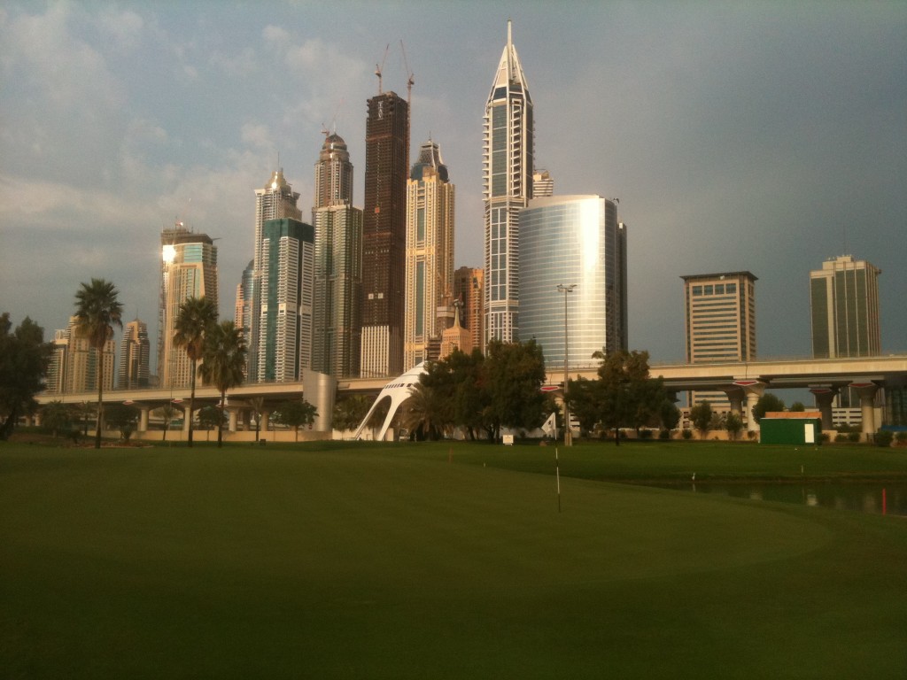 18th green and Dubai skyline
