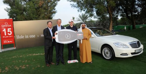 Stephen Gallacher earns the key of a new Merc for ace 2012 Dubai Desert Classic.(red)