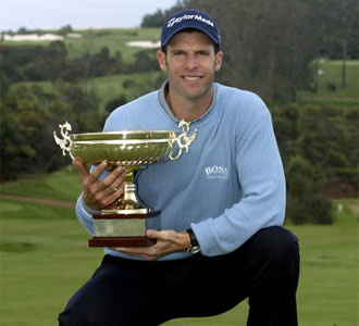 Bradley Dredge of Wales poses with the trophy
