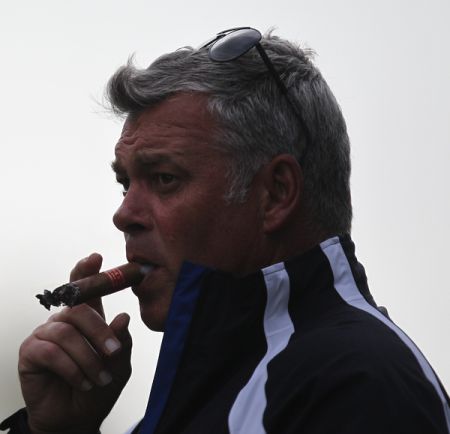 Darren Clarke chomping on a cigar (red)