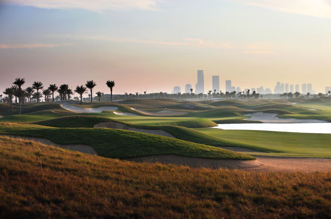 Saadiyat Beach GC with Abu Dhabi skyline in background