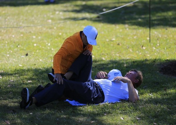 Ernie Els clearly in agony as he makes his way to the 2nd tee during day one at the WGC Cadillac championship.   (Photo - Fran Caffrey / www.golffile.ie)