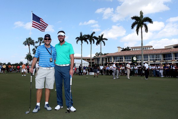 Scott Jamieson and his caddy, Lee soaking up the atomsphere of the WGC - Cadillac Championship.  (Photo - www.europeantour.com)