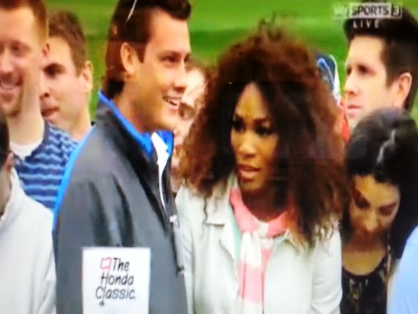 World No. 1 Serena Williams looking slightly bemused shortly after being stopped in taking a photo of Tiger Woods on the 17th tee.