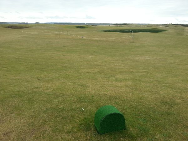 Work (area roped) on mounding at the approach to the 7th green.  (Photo - www.golfbytourmiss.com)