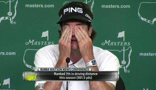 Bubba Watson wiping tears from his eyes.