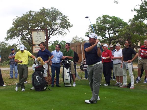 Shane Lowry tees off the 17th and with Rory McIlroy again on this mobile phone. (Photo - www.golfbytourmiss.com)