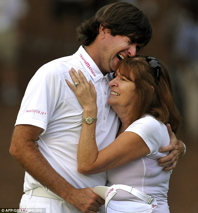 Bubba Watson breaks down 12 months ago in the arms of his mother, Molly.