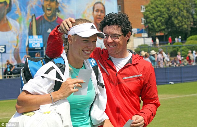 Rory McIlroy teasing girlfriend, Caroline Wozniacki at the Aegon International at Eastbourne in the UK. (Photo - Splash).