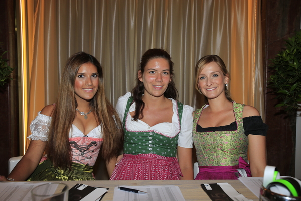 Young German ladies present to greet guests