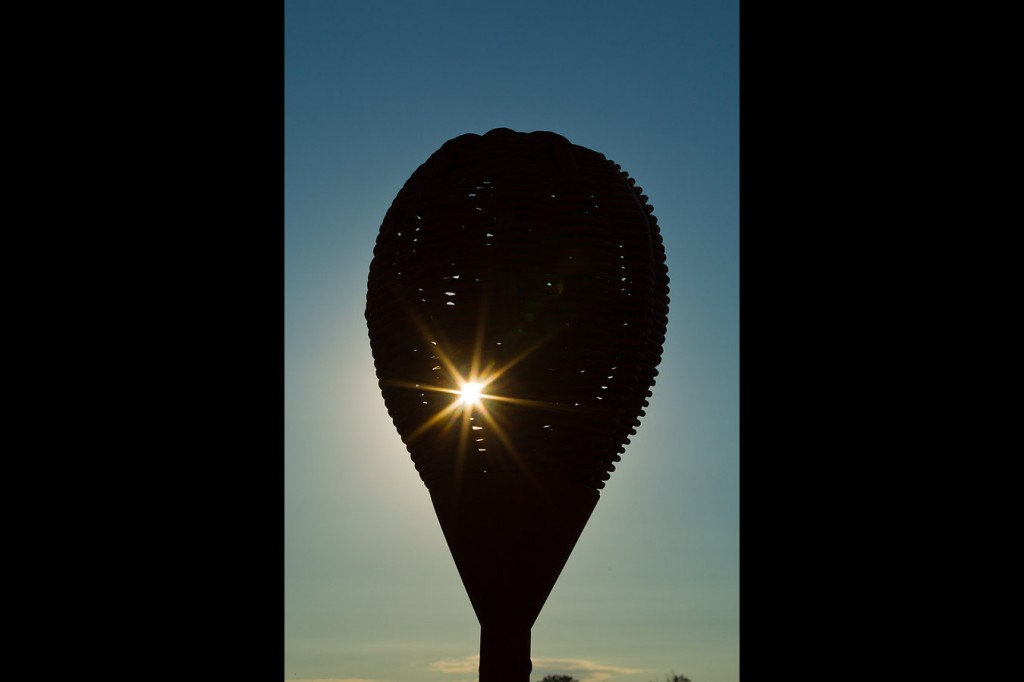 A light shines through Merion's wiker basket flagsticks as Tiger Woods declares everyone now focus on the US Open.