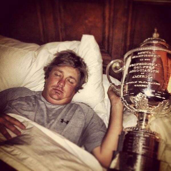 Jason Dufner in bed with his gleaming new friend - the Rodman Wanamaker Trophy - (Photo - Amanda Dufner)