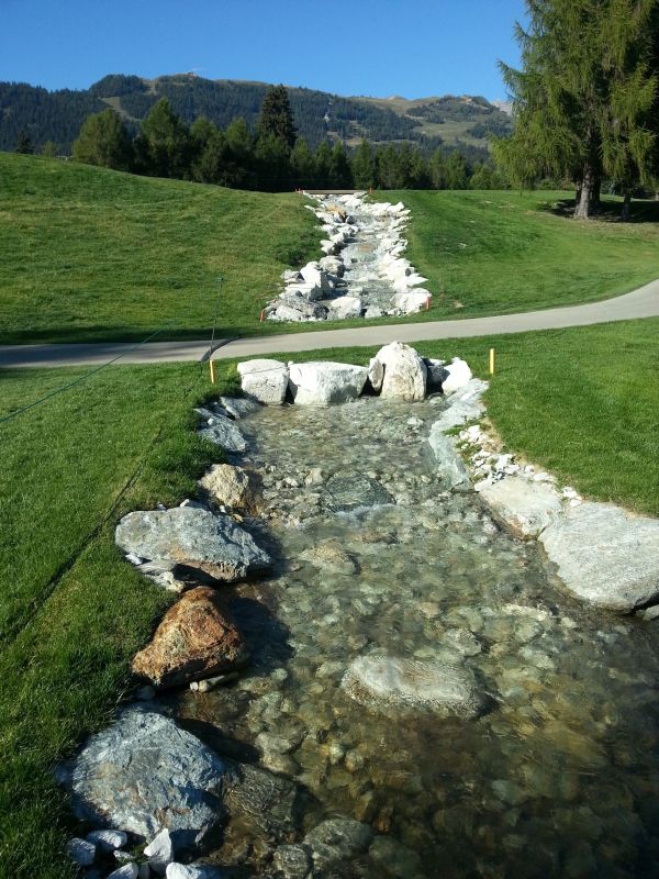 10th Hole - Water hazard flows left and downhill across the par four, 17th.