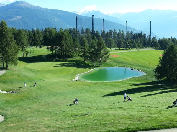 10th Hole - Water hazard flows left and downhill across the par four, 17th.
