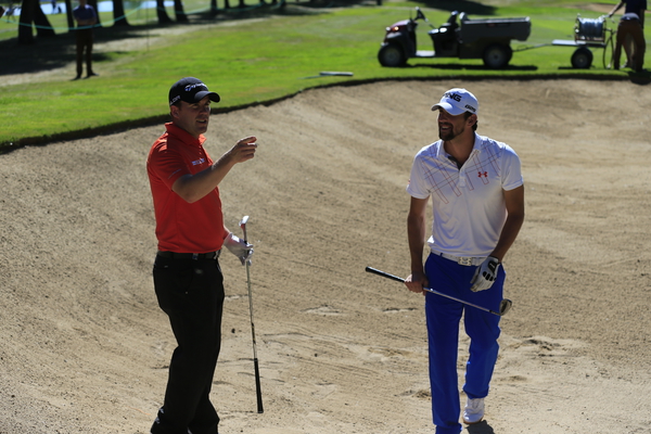 Richie Ramsay offering 18-time gold medal winning Michael Phelps a golf lesson during today's Omega European Masters Pro Am. (Photo - Eoin Clarke/www.golffile.ie)