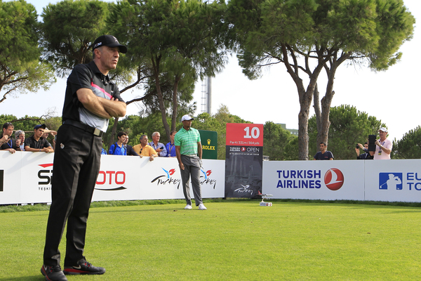 Ahmet Agaoglu watches Tiger Woods during the pro-am ahead of the 2013 Turkish Airlines Open. (Picture Stuart Adams www.golftourimages.com: 6th November 2013