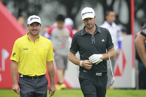 Dustin Johnson and Graeme McDowell  walk off the 3rd tee during Sunday's Final Round of the 2013 WGC-HSBC Champions.  (Photo -  Eoin Clarke/www.golffile.ie)