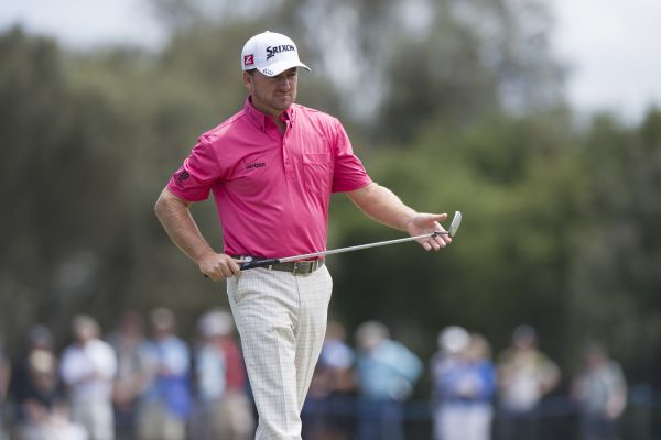 Graeme McDowell checks his line of his putt on the 7th during the second round of the World Cup at Royal Melbourne (Photo: Anthony Powter)