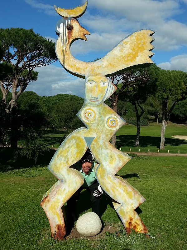 Davy Patterson gets up close with sculpture on 16th tee.