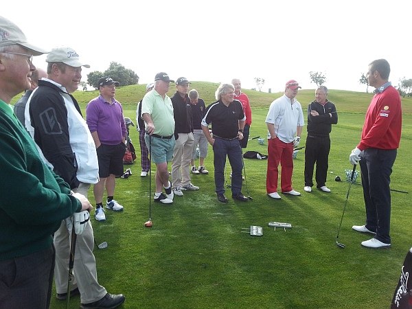 Portugal No. 1 Ricardo Santos offering his advice to Crail Golfing Society members.