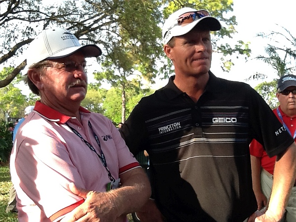 Ian Triggs and the coach to John Senden and Karrie Webb watching TV coverage moments before Senden is confirmed as 2014 Valspar Championship. (Photo - www.golfbytourmiss.com)
