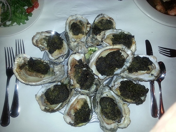 A dozen of the famed New Orleans oysters with topping