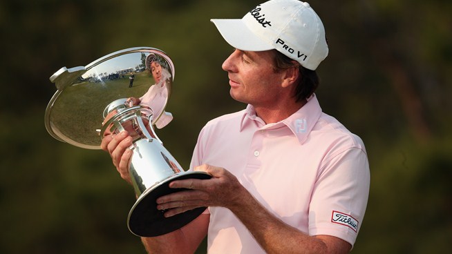 Brett Rumford with supercaddy John 'Ronnie' Roberts on the bag captured last year's Ballantine's Championship.