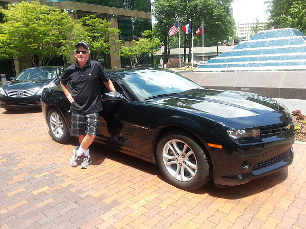 Bernie beside the Chevy Camaro in Atlanta.