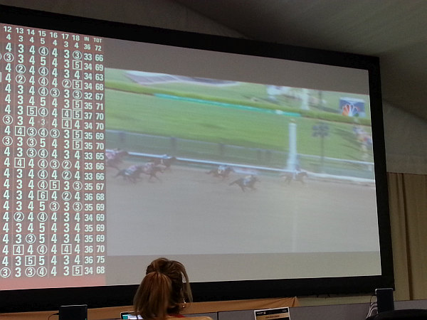 California Chrome crosses the finish line an easy winner as Tour Miss looks on.