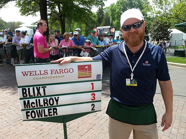 Rory McIlroy shoots a three under par 69 as ISMs Nick Mullen gets himself in the shot wearing a pink shirt. (Photo - www.golfbytourmiss.com)