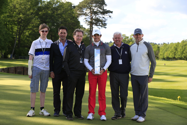 Rory McIlroy celebrates his BMW PGA victory with among others coach Michael Bannon (3rd left), manager Sean O'Flaherty (2nd left) and his father Gerry (2nd right). (Photo - Fran Caffrey www.golffile.ie)