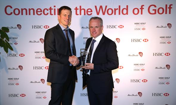 Tony Judge (right) receives the award in Abu Dhabi.