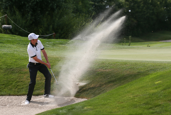 David Lloyd's (www.golffile.ie) super shot of England's Ross Fisher hitting out of bunker in the opening round of the BMW International Open.
