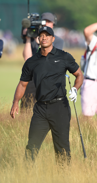Tiger Woods playing from the rough at the 17th hole and on route to a triple bogey but still managing to make the cut in his first Major this season. (Photo - Fran Caffrey/www.golffile.ie)