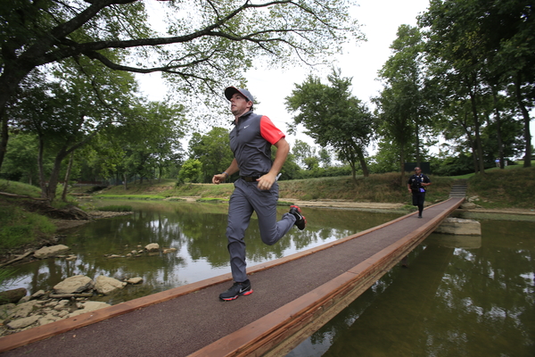 Rory McIlroy caught running across a bridge at Valhalla's ninth hole moments before running up a '7' at the next hole. (Photo - Eoin/Clarke/www.golffile.ie)