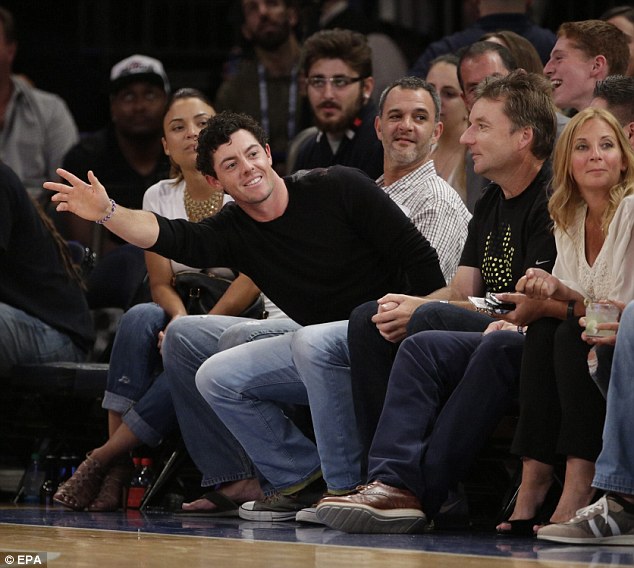 Rory McIlroy waves to Andy Murray at USA -v- Costa Rica basketball match last Friday at Maddison Square Garden in New York