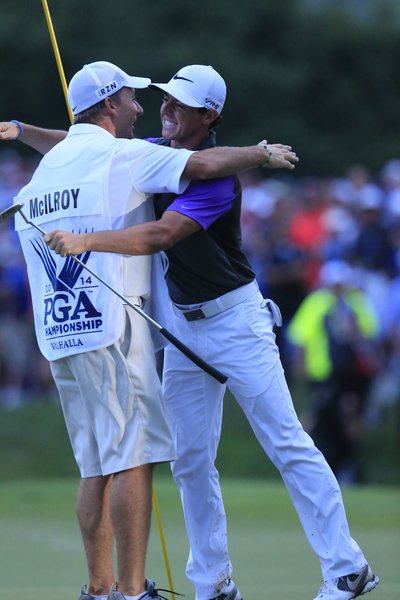 Rory McIlroy embraces caddy J P Fitzgerald after becoming the fourth youngest winner of a Major. (Photo - Eoin Clarke/www.golffile.ie)