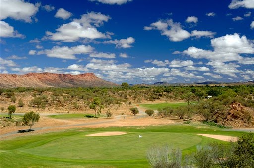 The unmistakable red-coloured MacDonnell Range standing watch over the Alice Springs Golf Club in the heart of Australia.