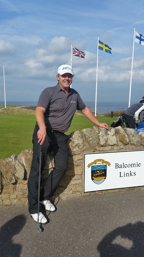 Joakim Haeggman under the Sweden flag ahead of teeing off for a first time on the Balcomie Links course at Crail.  (Photo - www.golfbytourmiss.com)