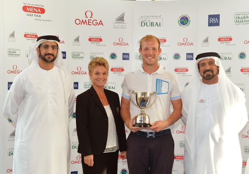 Dubai Creek Open winner Luke Joy with Mohamed Juma Buamaim, chairman of the MENA Golf Tour, in the presence of Mustafa Al Hashimi, CEO of wasl Hospitality and Leisure, and Paula Savage, lady captain of Dubai Creek Golf and Yacht Club.