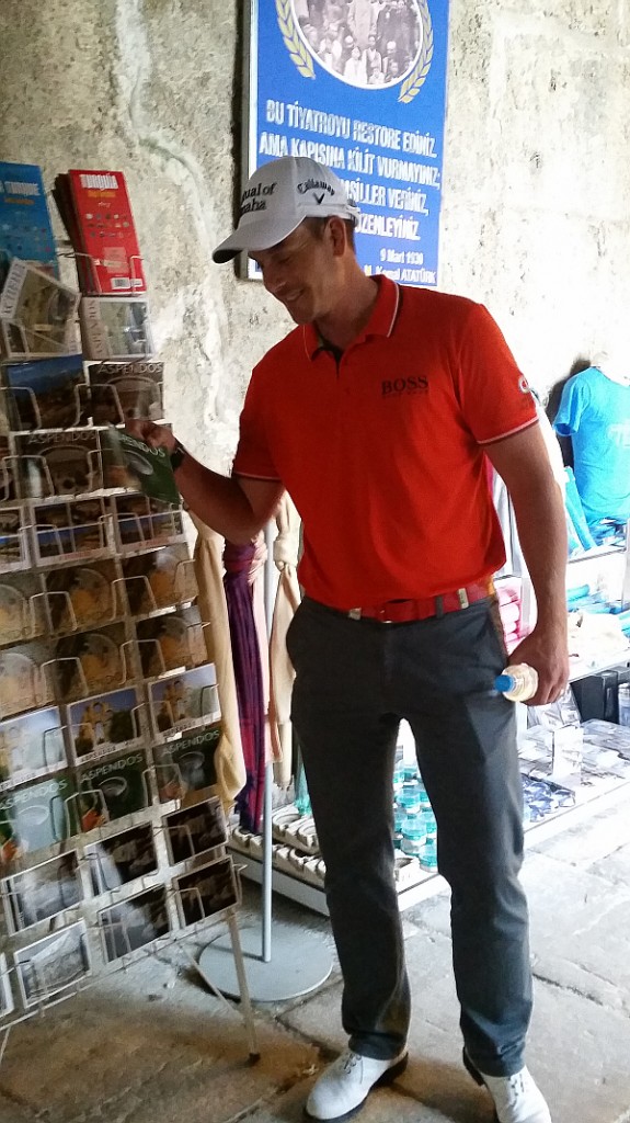 Henrik Stenson admiring the postcards on display.