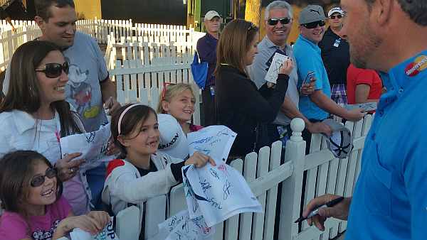 Graeme McDowell grants the 9-year old girl her request. (Photo - www.golfbytourmiss.com)