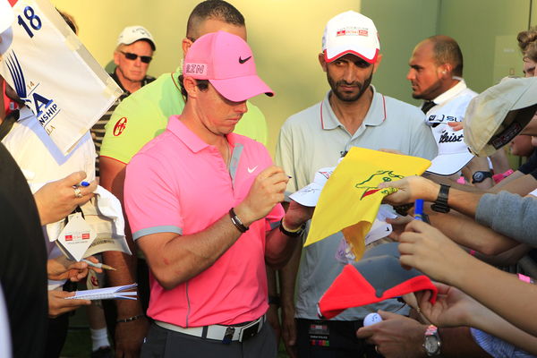 Rory McIlroy mobbed after his round of an eight under par 64 but then no one will want your editor's autograph who was again lurking in the background.  (Photo - Stuart Adams/www.golftourimages.com)