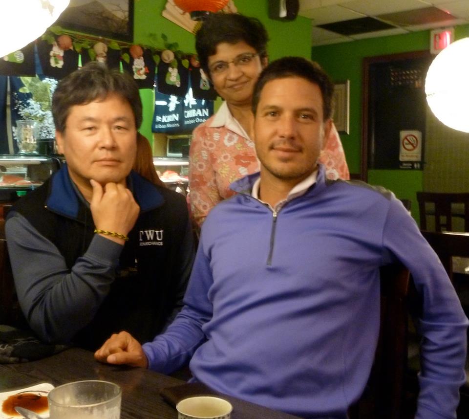 Kiran Kanwar (standing) havine dinner with Chris Como, the newly-appointed coach to Tiger Woods, and biomechanics guru Dr Young-Hoo Kwon.